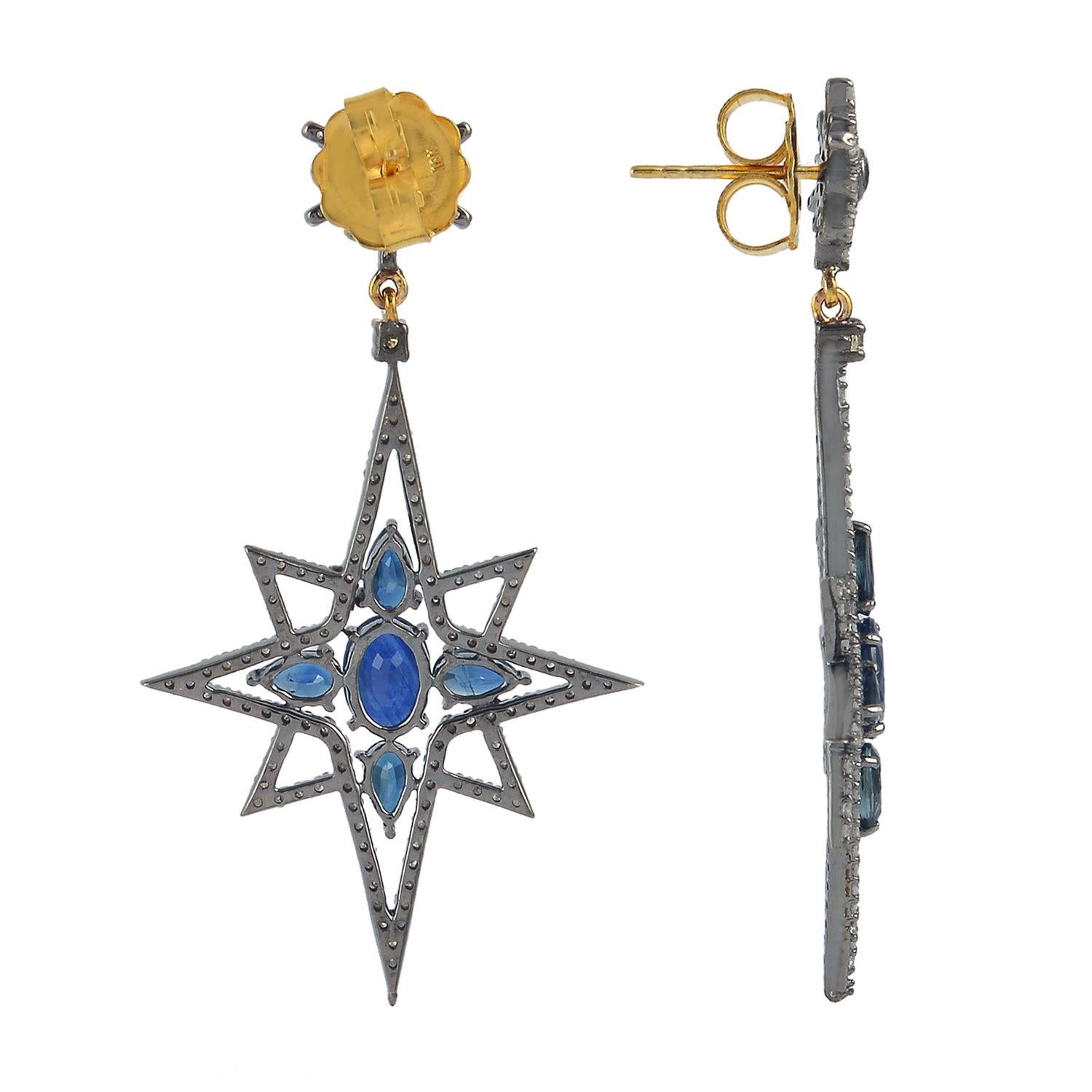 Cast in 18-karat gold and sterling sliver, these drop earrings are set with 4.46 carats blue sapphire and 1.88 carats of sparkling diamonds. 

FOLLOW  MEGHNA JEWELS storefront to view the latest collection & exclusive pieces.  Meghna Jewels is