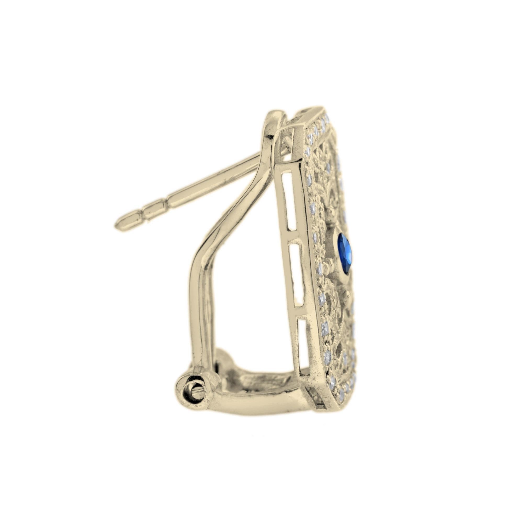 Featuring 0.15 carat blue sapphire at each center and ornate vintage inspired design, these earrings are fit for any outfit. The colorful center stone is accent by sparkling round cut white diamonds that total to 0.17 carats floral openwork setting.