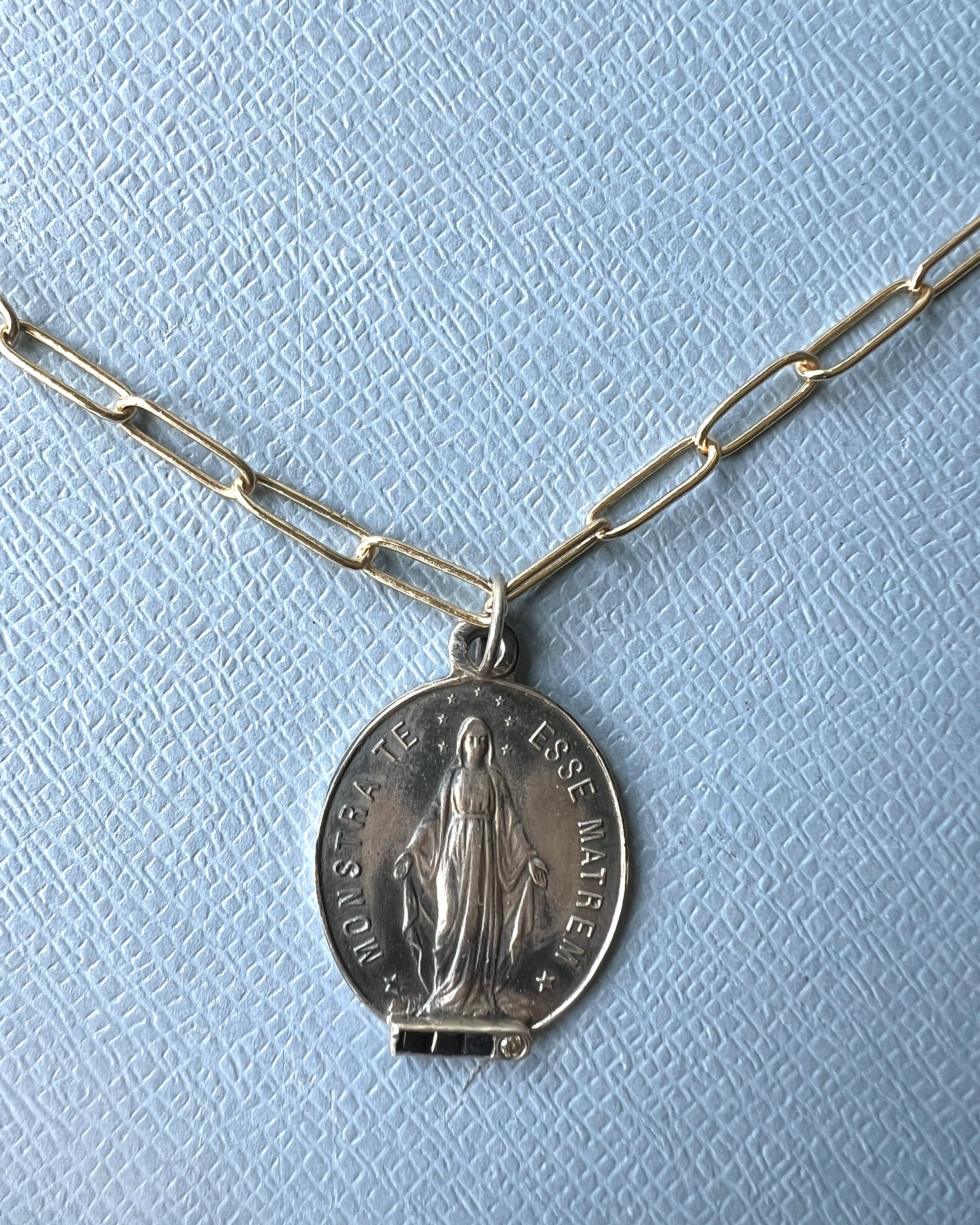 Blue Sapphire Diamond Virgin Mary Silver Medal Gold Plated Chain Necklace

This Oval Virgin Mary in Silver with settings of a round diamond, and 3 squares of blue sapphire and a 14k Gold Plated Chain.

Monstra Te Esse Matrem – Show Thyself as