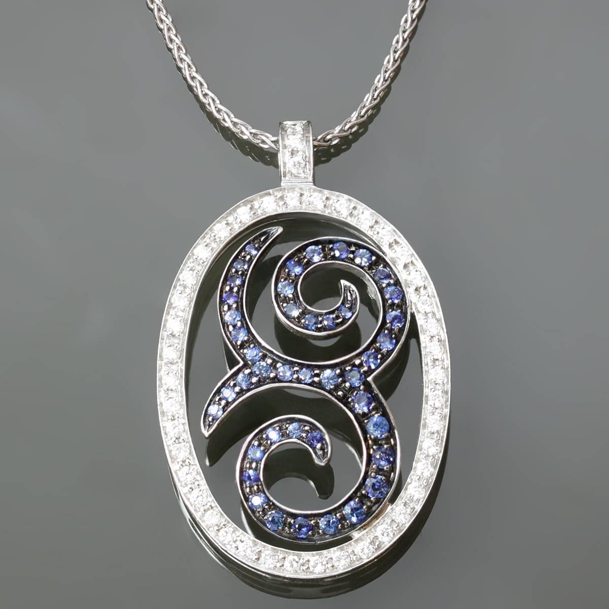 This modern wheat chain necklace is made in 18k yellow gold and features an open pendant with a swirl motif set with faceted round blue sapphires of an estimated 0.69 carats and surrounded by an oval frame set with sparkling round diamonds of an