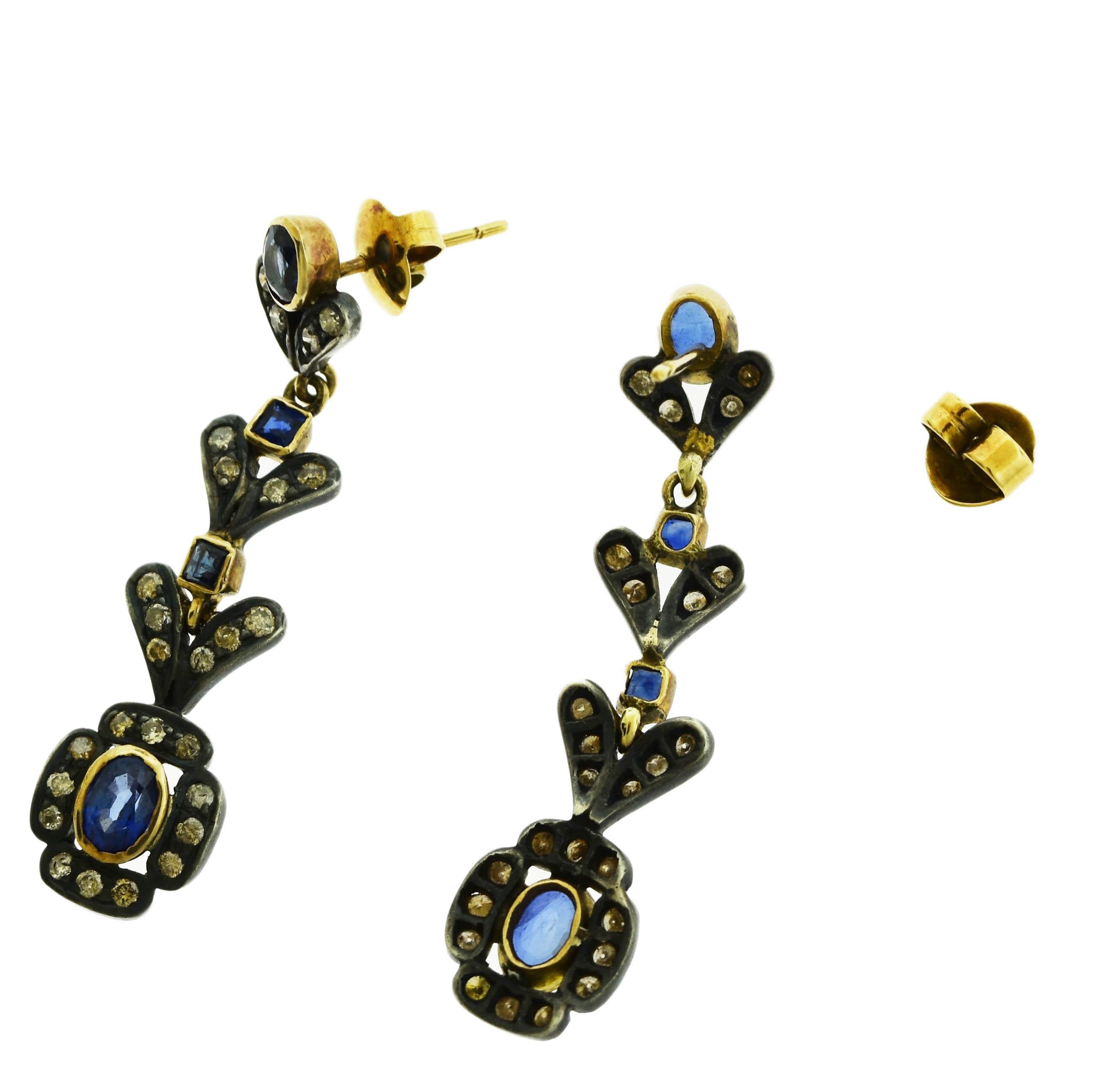 Style: Earrings

Metal: 18K Yellow Gold 

Main stone: Blue Sapphires

Carat weight main stone: approx 4 ct tw

Secondary stone: Diamonds

Carat weight sec stone : approx 3 ct tw

Total Item Weight(Grams): 3.7 g (each earring)

Length:  1