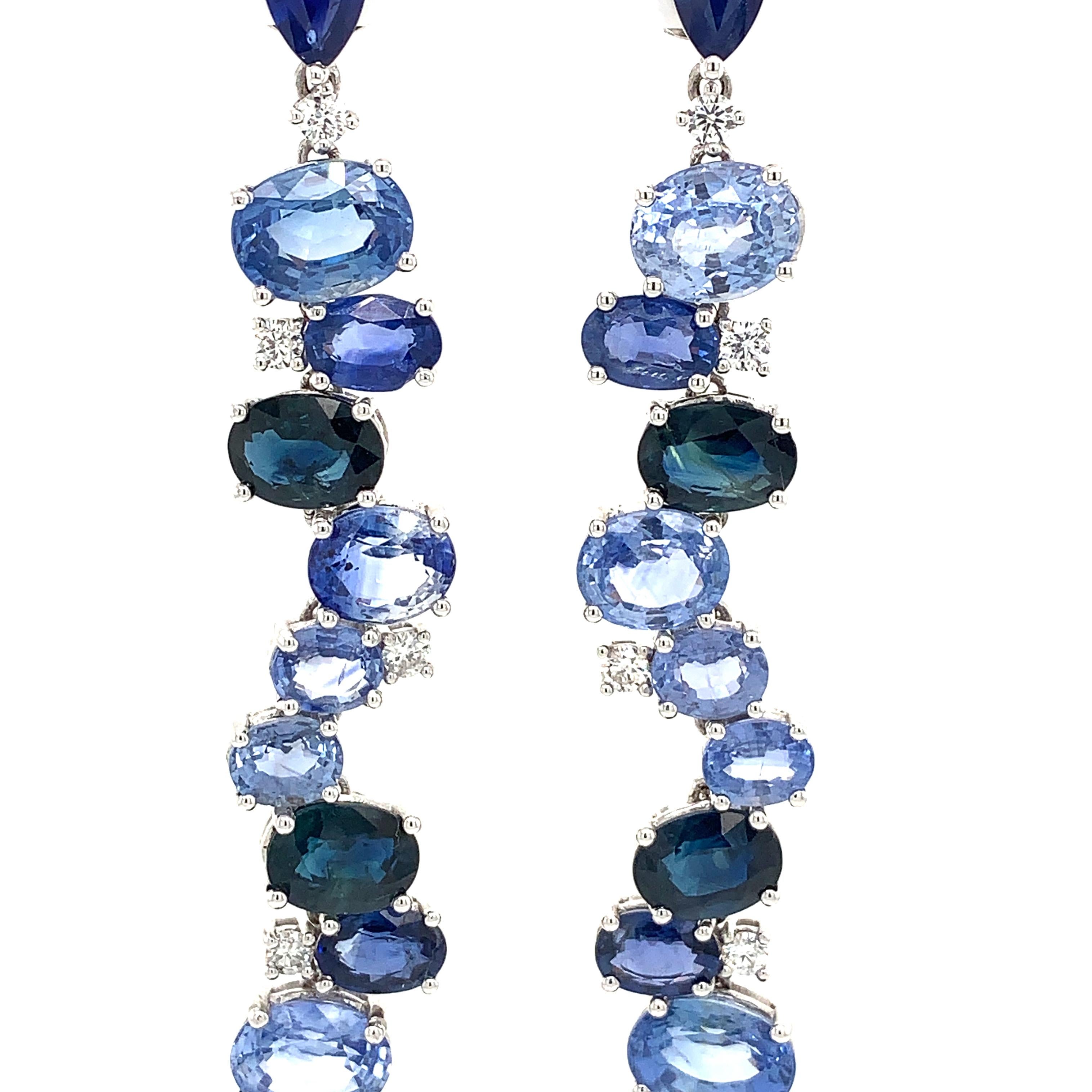 Midnight Blue Collection

Oval blue Sapphire and Diamond Drop Dangle earrings set in 18K white gold.

Blue Sapphire: 23.58ct total weight.
Diamonds: 0.52ct total weight.
All diamonds are G-H/SI stones.