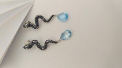 Blue Sapphire, Emerald and Blue Topaz Snake Earrings set in Silver Settings
