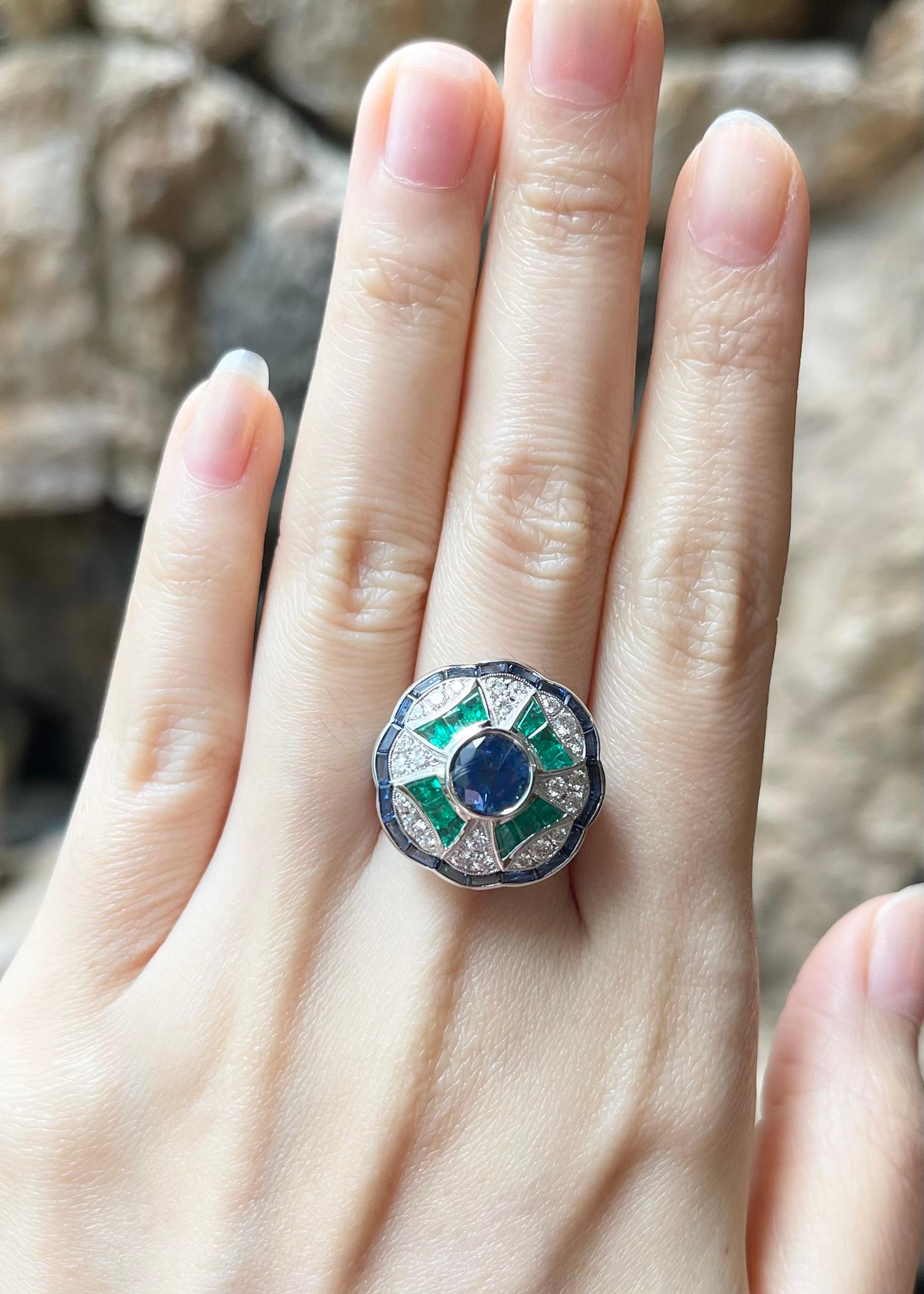 Blue Sapphire 1.81 carats, Emerald 0.89 carat, Blue Sapphire 1.99 carats and Diamond 0.46 carat Ring set in 18K White Gold Settings

Width:  2.0 cm 
Length: 2.0 cm
Ring Size: 55
Total Weight: 10.19 grams

