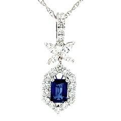 Blue Sapphire and Diamond Halo Pendant in White Gold with White Gold Chain