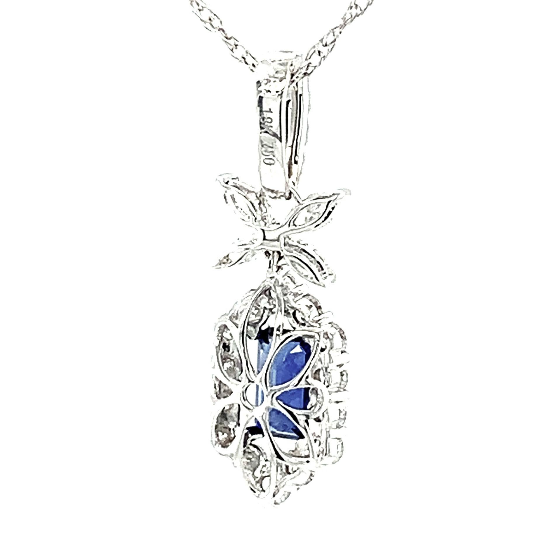 Brilliant Cut Blue Sapphire and Diamond Halo Pendant in White Gold with White Gold Chain For Sale