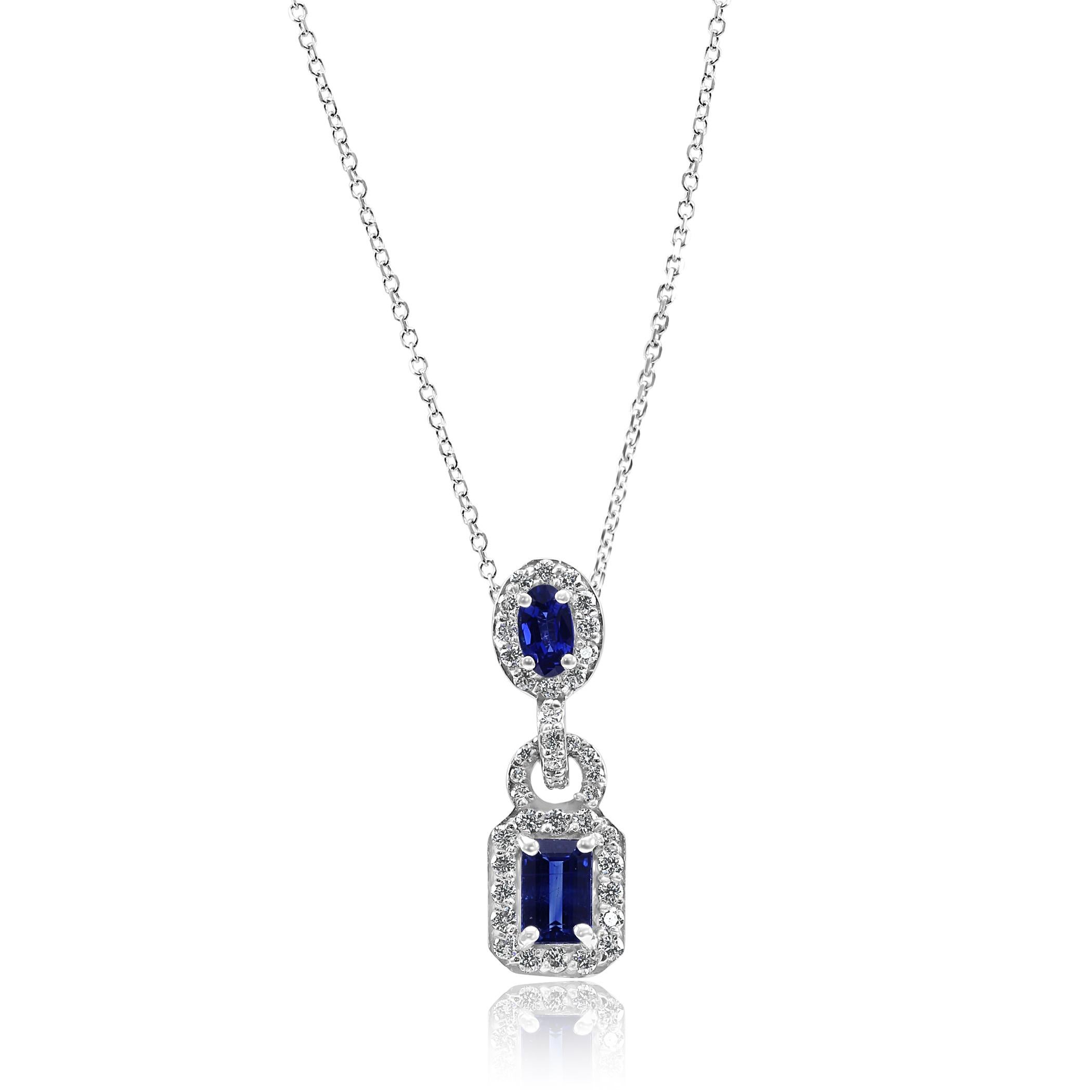 Blue Sapphire Emerald Cut 0.71 Carat set with Blue Sapphire Oval 0.32 Carat Encircled in Single Halo of White G-H Color VS-SI Clarity Diamond Rounds 0.45 Carat in 14K White Gold Gorgeous Drop Pendant Chain Necklace.
Total Weight 1.48 Carat

Style