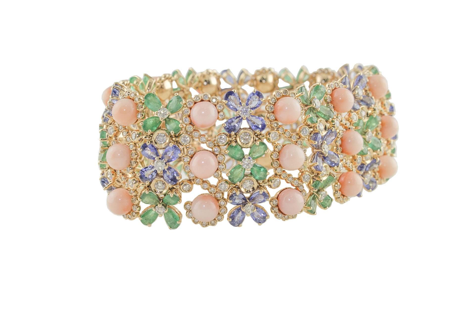 Amazing link bracelet in 14k rose gold composed of emeralds and blue sapphires flowers, pink coral beads and white diamonds.
Diamonds 7.30 ct 
Emeralds, Blue Sapphires 35.52 ct
Pink Coral 7.70 g
Tot.Weight 67.00 g
R.F ugrcg

For any enquires, please