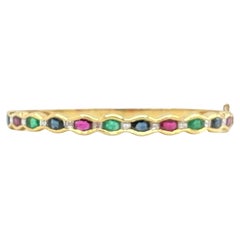 Bracelet en saphir bleu, émeraude, ovales de rubis et diamant blanc taille Asscher en 18K