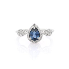 Anillo de compromiso de zafiro azul, anillado con diamantes en oro blanco de 18 quilates