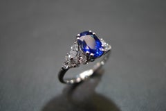 Blue Sapphire Engagement Ring with Marquise Cut Diamond in 18K White Gold