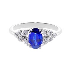 Blue Sapphire Engagement Ring with Marquise Cut Diamond in 18K White Gold