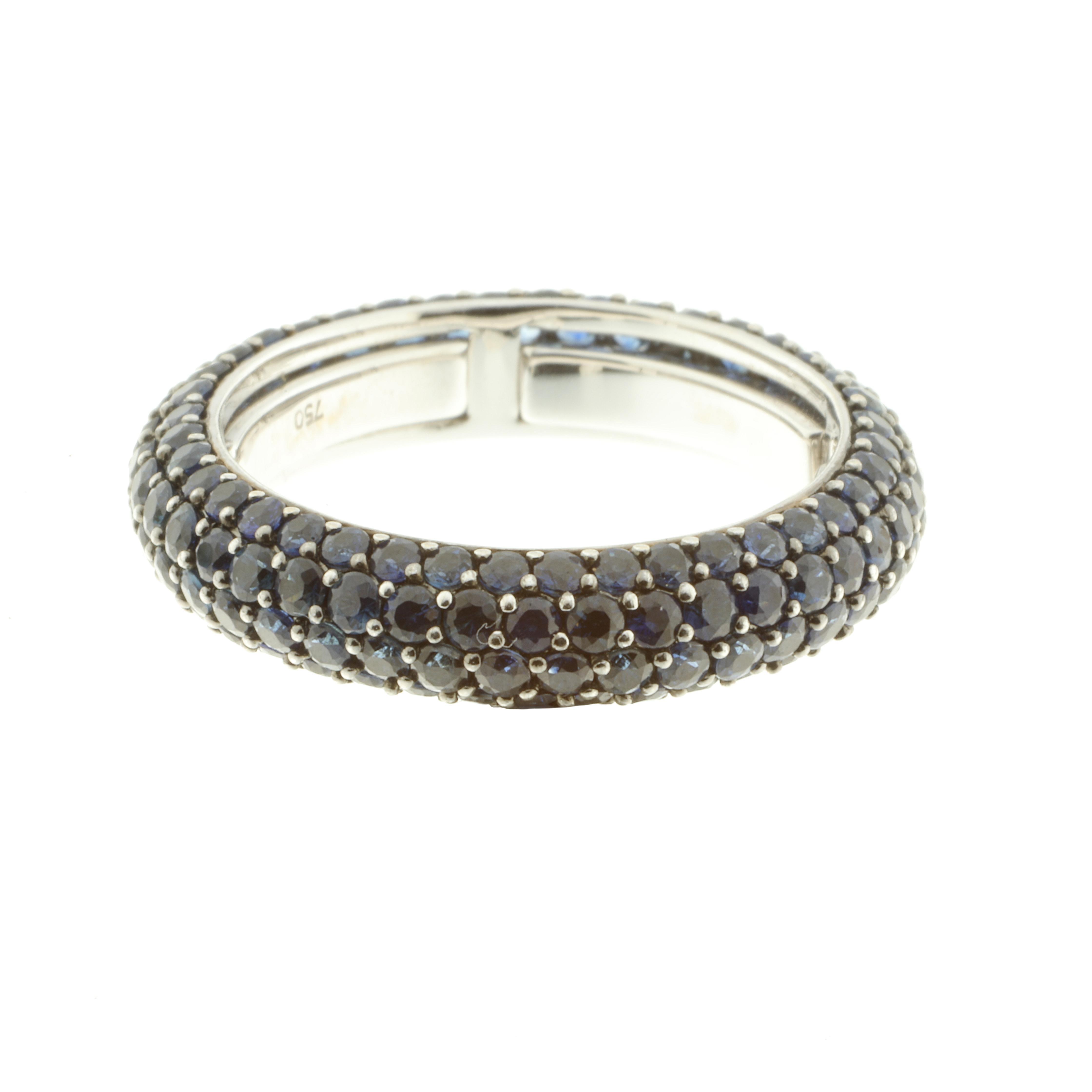 A luxuriously sleek and elegant 18 karat white gold and 3.59-carat blue sapphire eternity ring. The ring is fabulous to wear, inside the band are a series of sprung sizers which comfortably fit the ring to US sizes 6-7.25. 

The piece stands out as