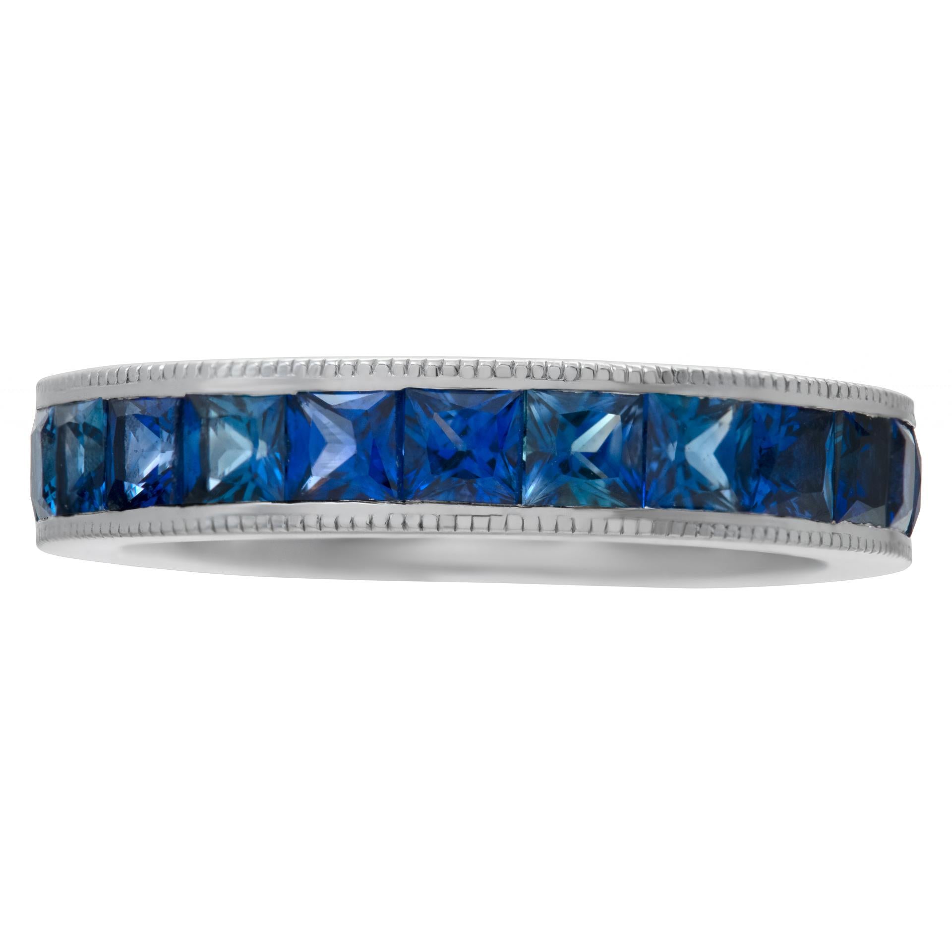Blue sapphire eternity band in 14k white gold with approximately 4.50 carats in princess cut  blue sapphires. Size 7.25This Sapphire ring is currently size 7.25 and some items can be sized up or down, please ask! It weighs 4.1 pennyweights and is