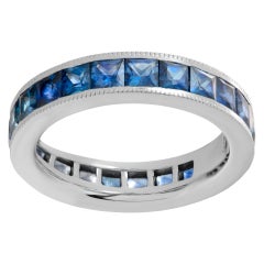 Blue sapphire eternity band in white gold