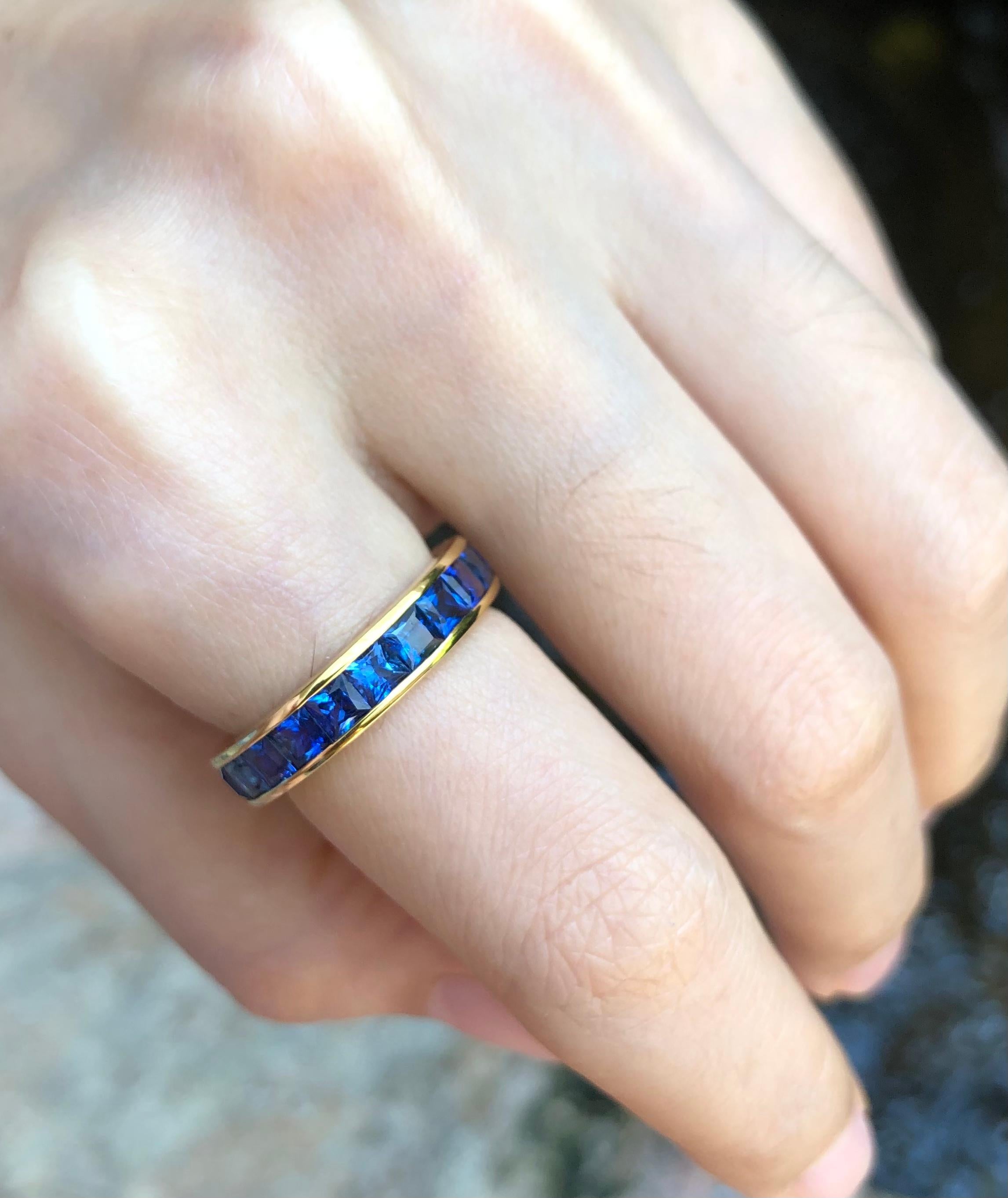 Contemporary Blue Sapphire Eternity Ring Set in 18 Karat Gold Settings For Sale