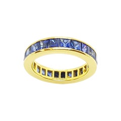 Blue Sapphire Eternity Ring Set in 18 Karat Gold Settings