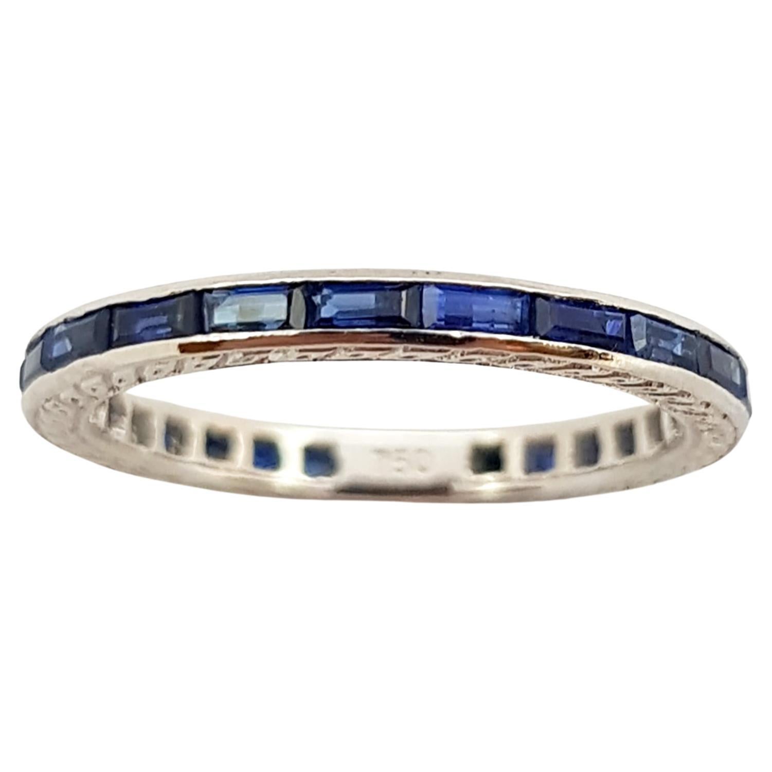 Blue Sapphire Eternity Ring Set in 18 Karat White Gold Settings For Sale