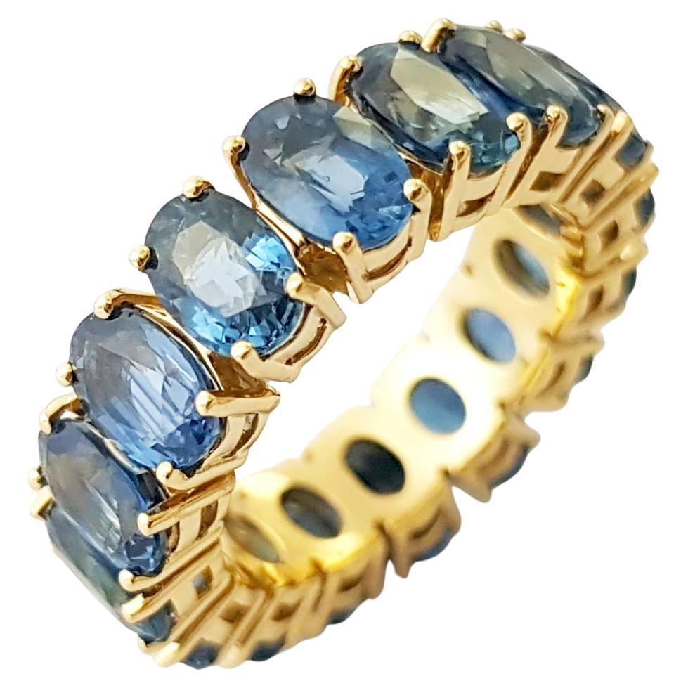 Anello Eternity con zaffiro blu e montatura in oro 18K