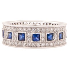 Anello Eternity con zaffiro blu e diamanti 2,2 carati totali in oro 14 carati