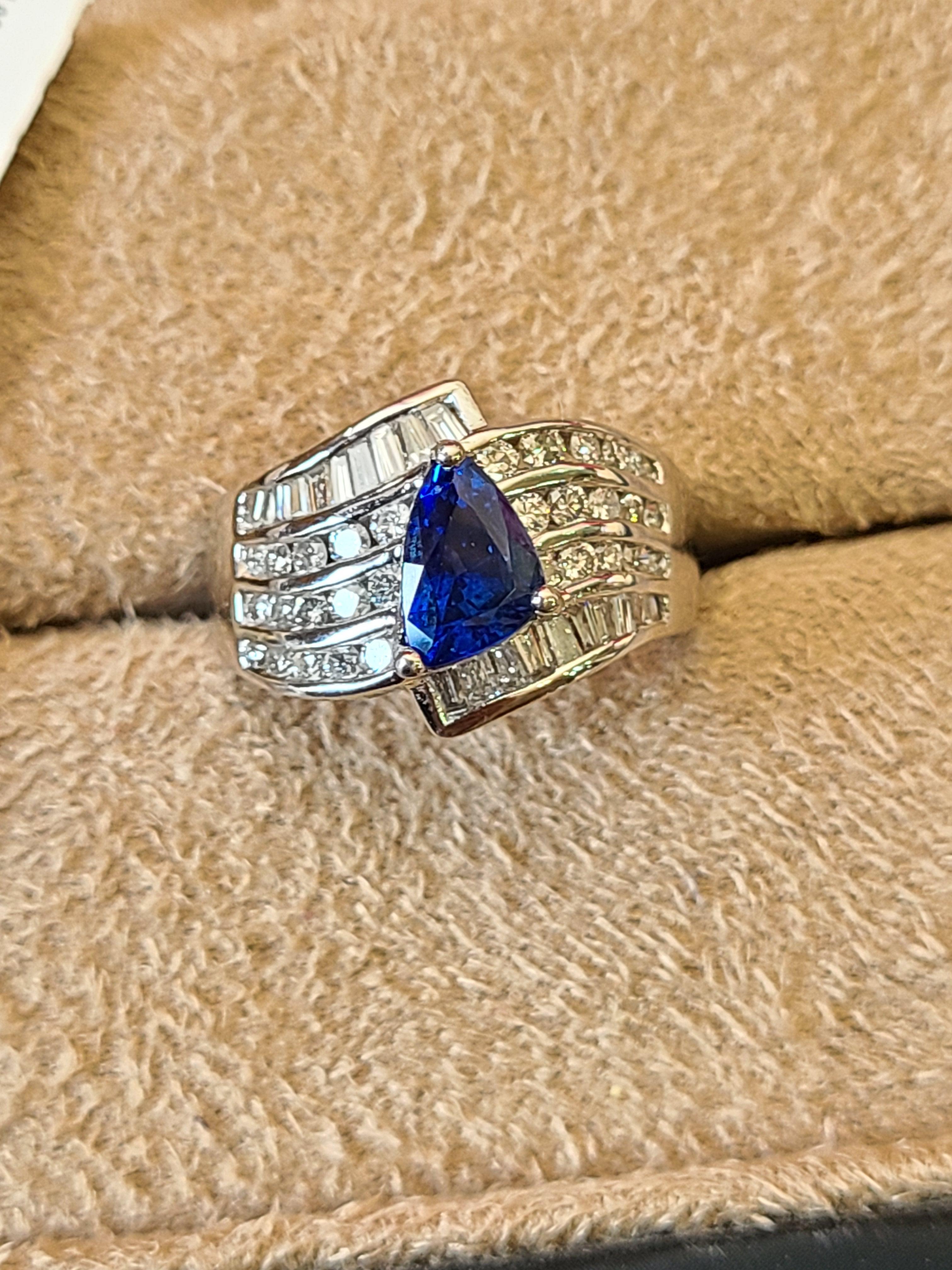 A top quality sapphire set in Platinum PT900 with diamonds. The blue sapphire originates from Sri-Lanka and is eye clean and top colour , weight of the sapphire is 1.59 carats and diamond weight is 1.11 carats. The ring dimensions in cm 1.4 x 2 x
