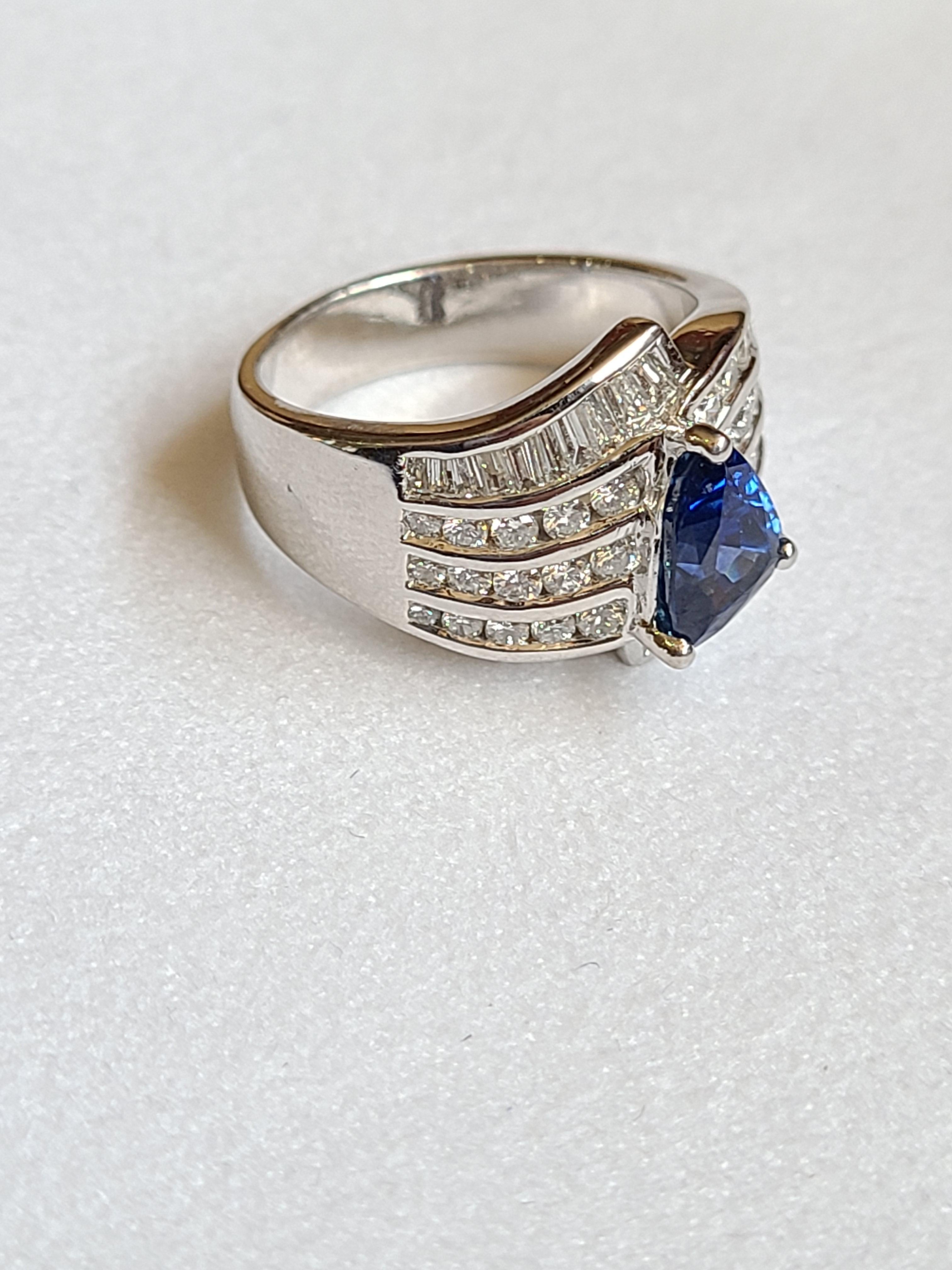 Modern Blue Sapphire Fancy Shape Ring Set in Platinum with Diamonds For Sale