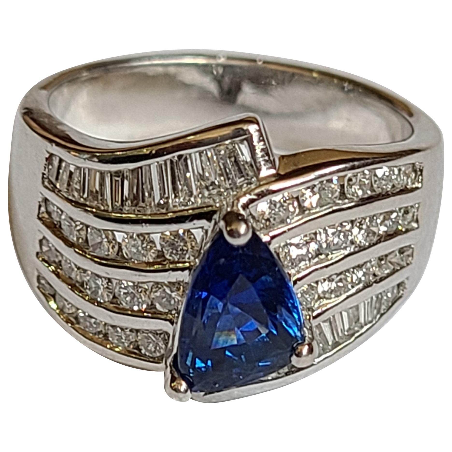 Blue Sapphire Fancy Shape Ring Set in Platinum with Diamonds For Sale