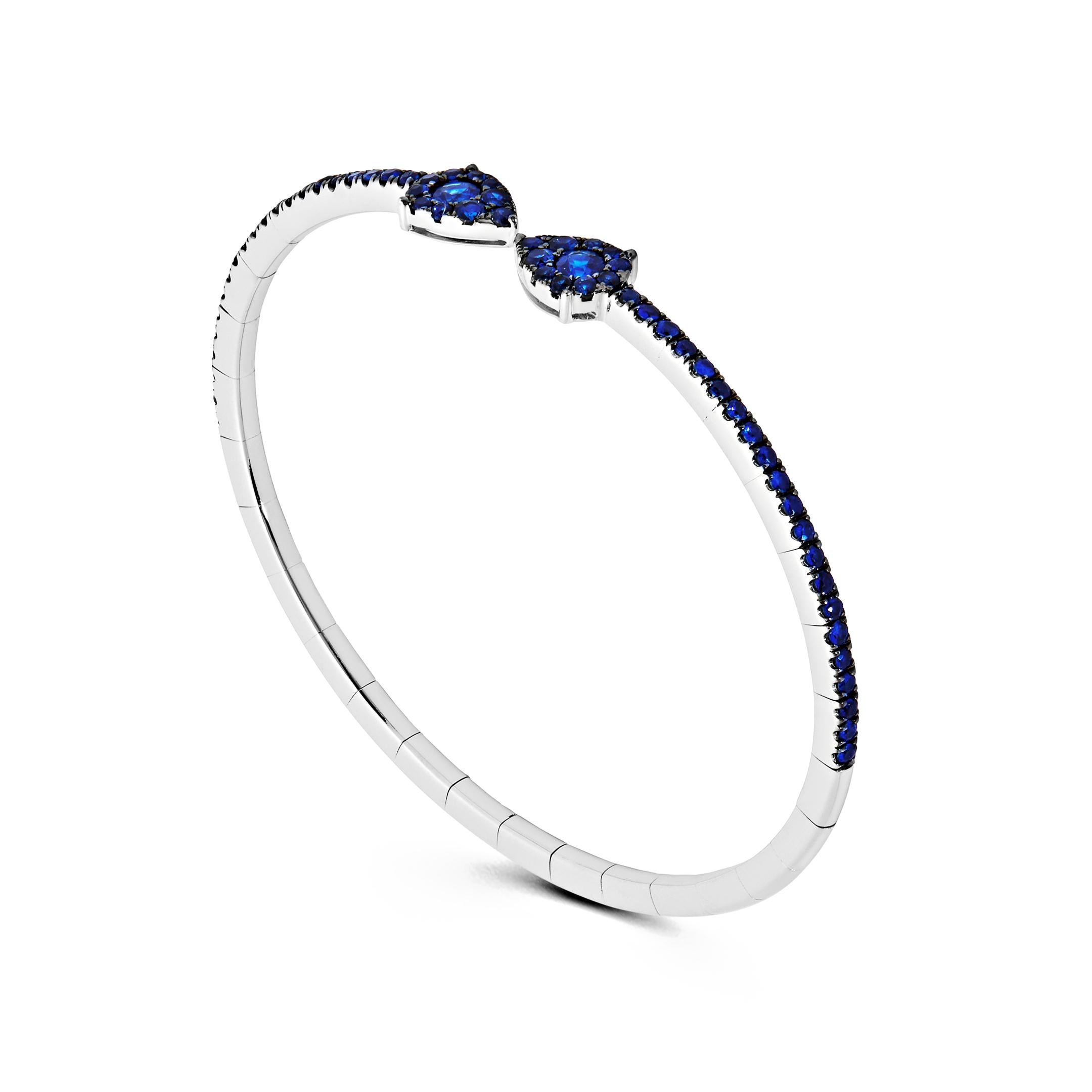 The epitome of effortless glamour, the Blue Sapphire Flexible Cuff Bracelet is the ideal layering piece. Thanks to its stretchy technology, the 18-karat white gold and blue sapphire jewel can be comfortably slipped on and off. Pair several of these