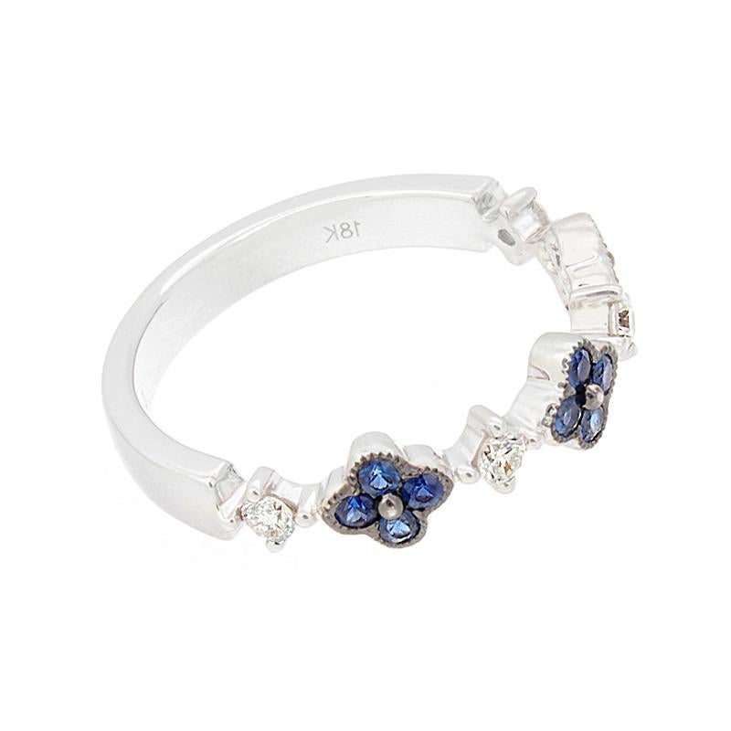A delicate and feminine ring featuring 0.27 carats of ocean blue sapphire florets and 0.16 carats of diamonds set in 18K white gold.  

Currently ring size 6.25
