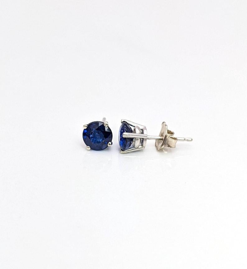 These simple studs are quite a statement with the deep rich blues of the sapphire. Made to be worn every day with safe and secure push back closures!

Let us know the gold color you would prefer. Available in solid 14k - yellow gold, white gold &
