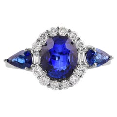 Bague cocktail en or blanc 14 carats avec saphir bleu et diamants