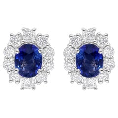 Clous d'oreilles en or blanc 18 carats avec saphirs bleus et diamants SI/H