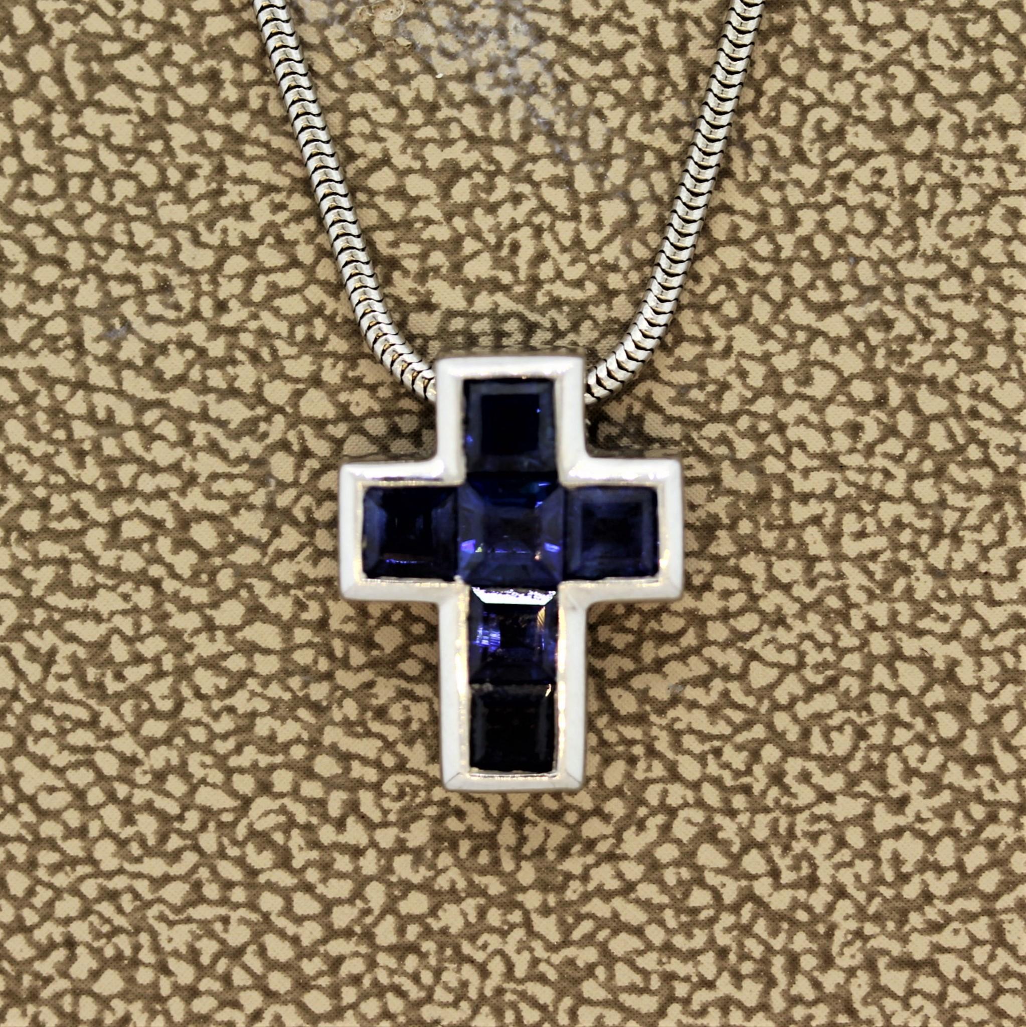 A beautifully made cross with square cut blue sapphires. There are 6 sapphires which weigh a total of 1.50 carats and are perfectly matching in shape and color. Made in 18k white gold and comes with an elegant gold rope necklace.

Pendant Length: