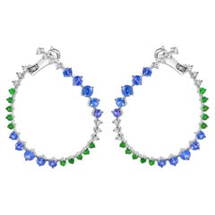 Orecchini con zaffiro blu, granato verde e diamanti in oro bianco 18 carati