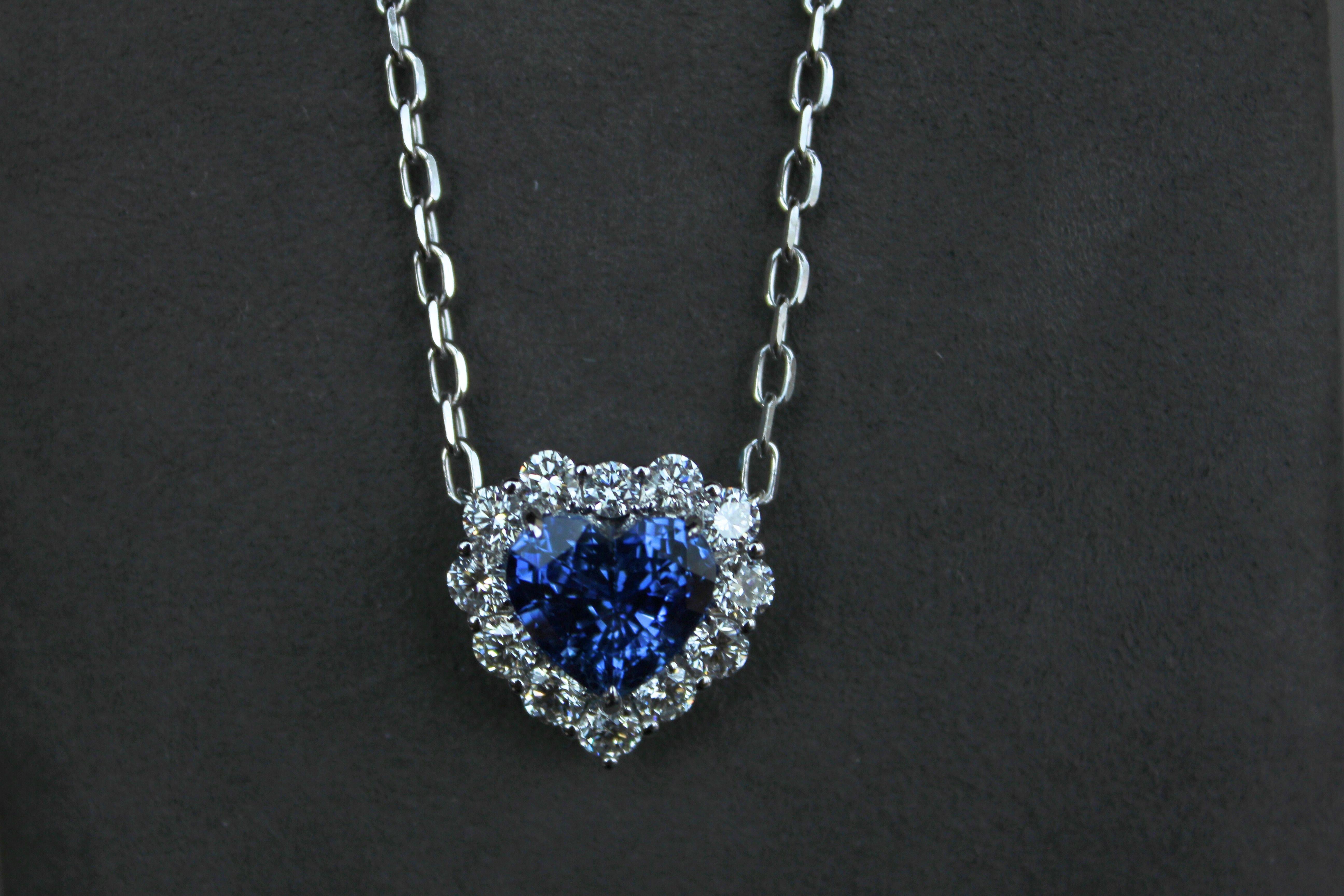 Embrace the refined beauty of this exquisite gemstone heart-shape pendant necklace.  Crafted with solid 18K gold and intricate detailing, the necklace features the highest-quality faceted diamond-cut chain that gracefully holds a natural brilliant