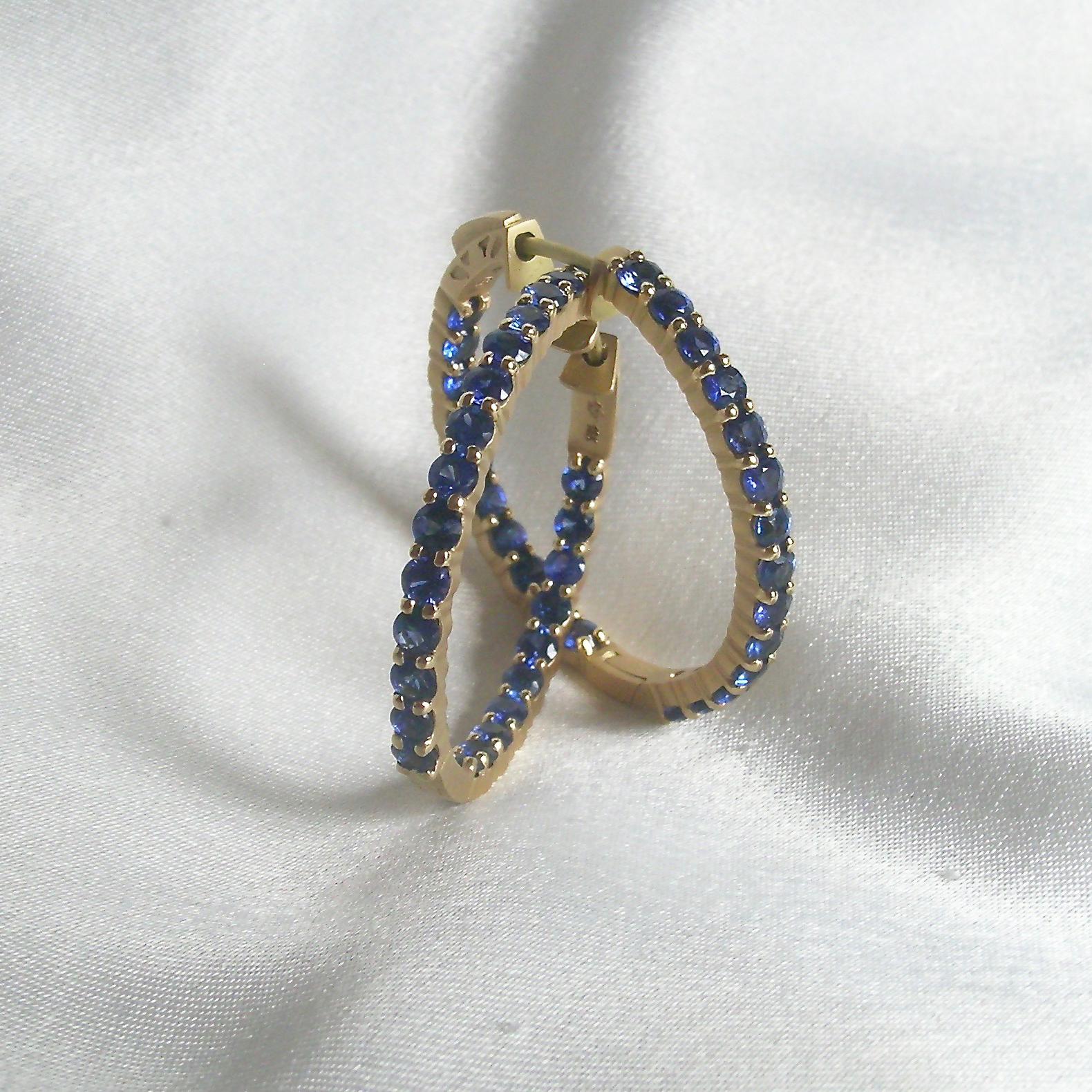 Over 4 carats of Ceylon Blue Sapphires are in these classic hoop earrings.  The earring can come in several sizs, the 3cm in diameter version is what is being shown here.  These classic hoops are full of color, great with jeans, white collar shirt
