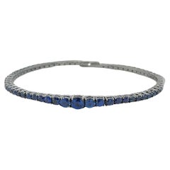 Bracelet tennis Majesty en or blanc et saphir bleu