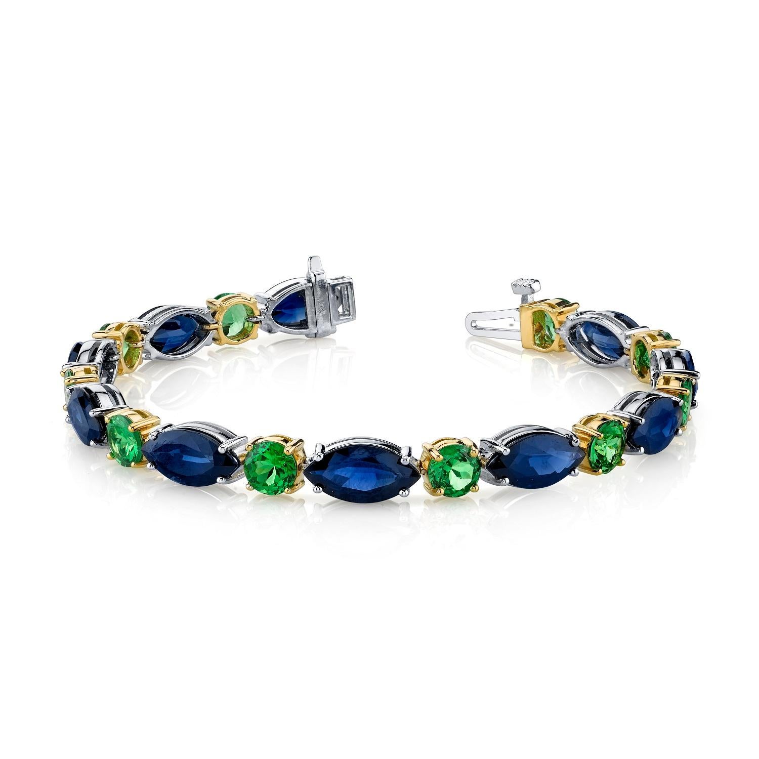 This stylish bracelet pairs royal blue sapphires with sparkling, grass-green tsavorite garnets in a modern take on the classic tennis bracelet. The sleek outlines of the marquise shaped sapphires create an elegant flow, with vivid green tsavorite