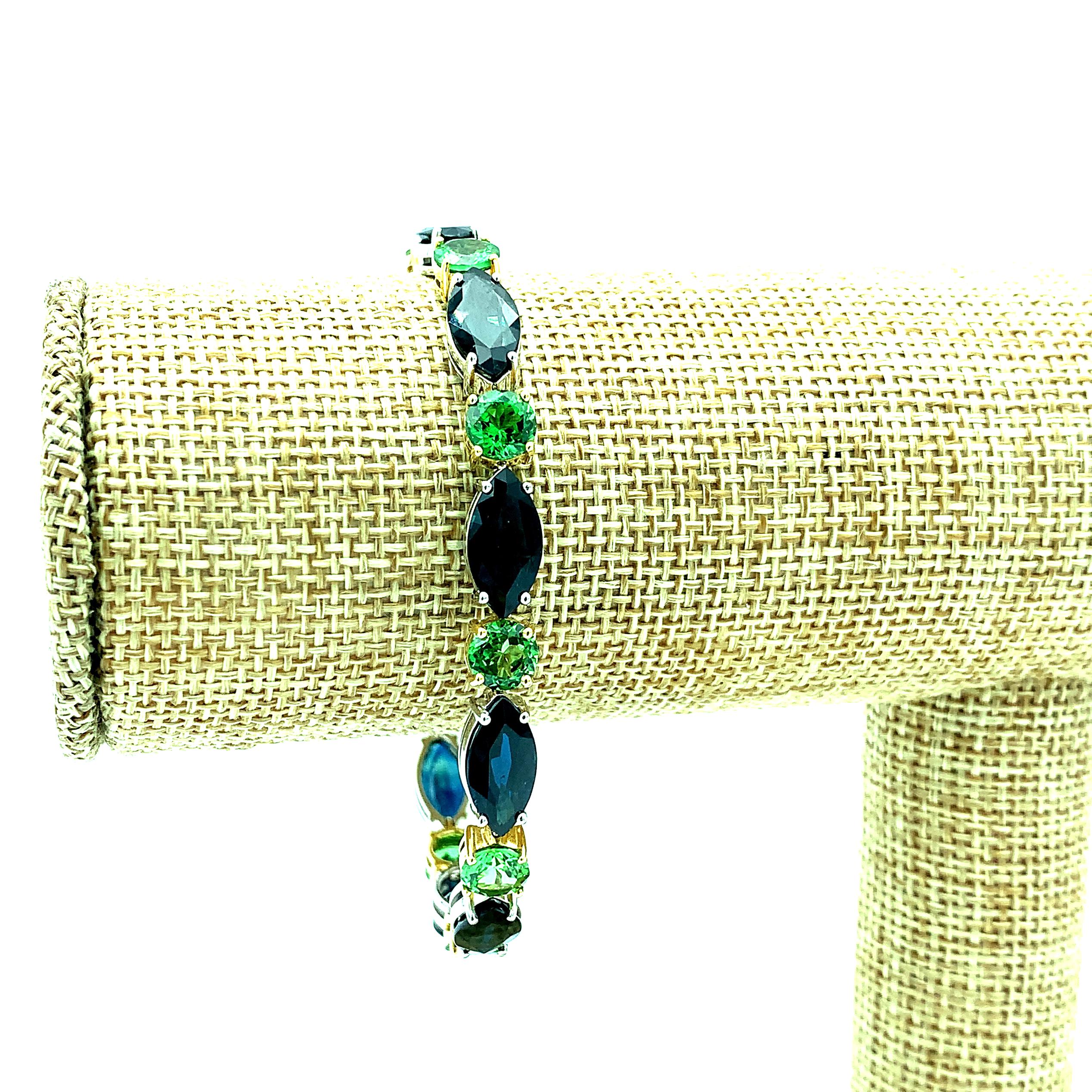 Marquise Cut Blue Sapphire and Tsavorite Garnet Tennis Bracelet in White and Yellow Gold For Sale