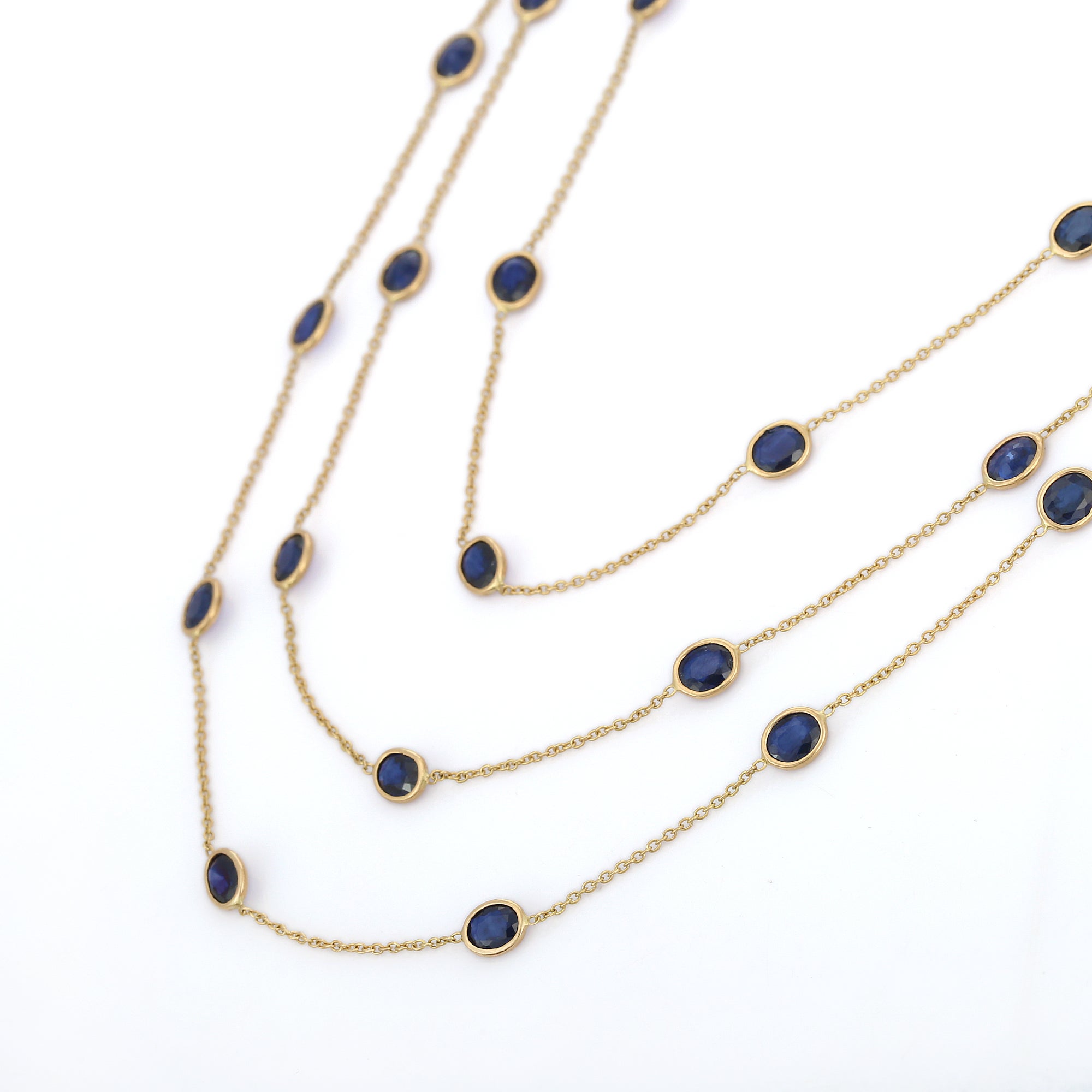 Blue Sapphire Necklace in 18K Gold studded with oval cut Blue sapphire pieces.
Accessorize your look with this elegant blue sapphire beaded necklace. This stunning piece of jewelry instantly elevates a casual look or dressy outfit. Comfortable and