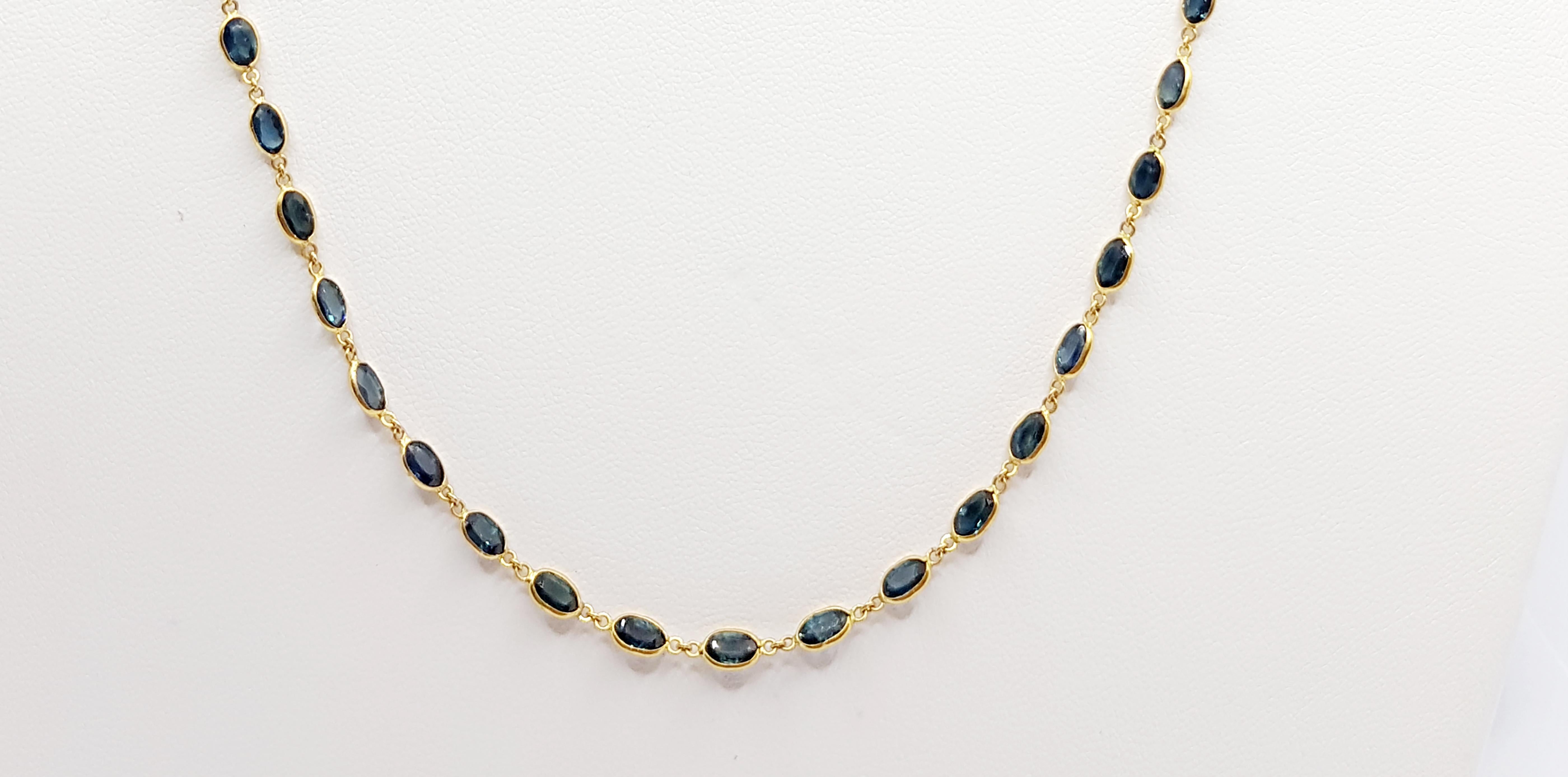 Oval Cut Blue Sapphire Necklace Set in 18 Karat Gold Settings For Sale