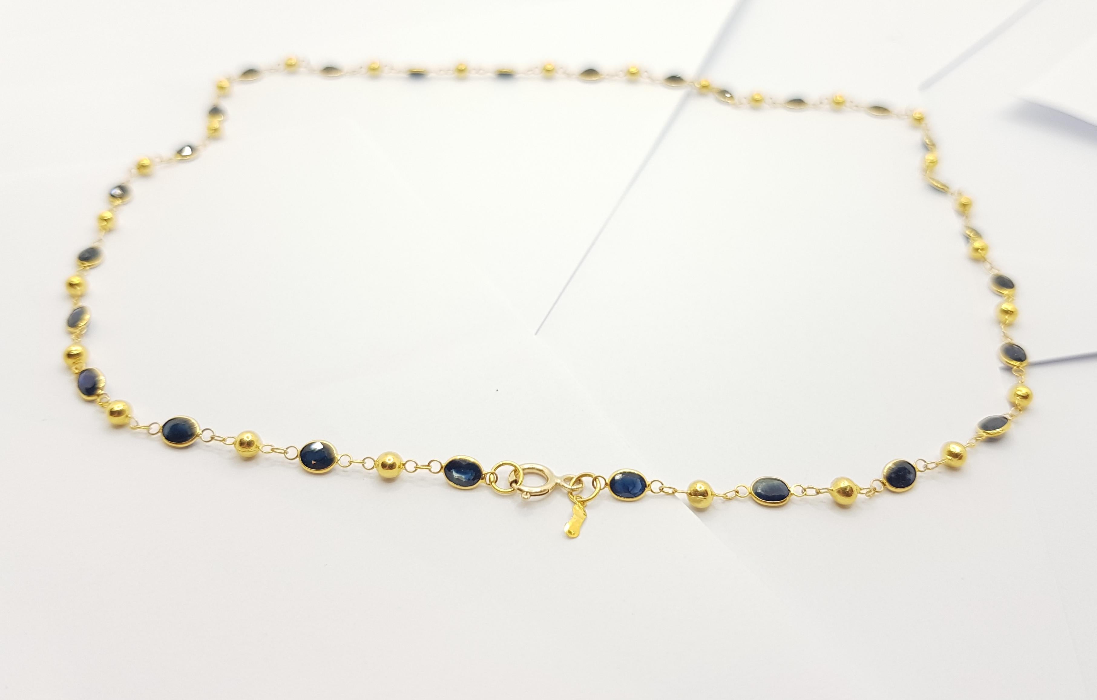 Women's Blue Sapphire Necklace Set in 18 Karat Gold Settings For Sale