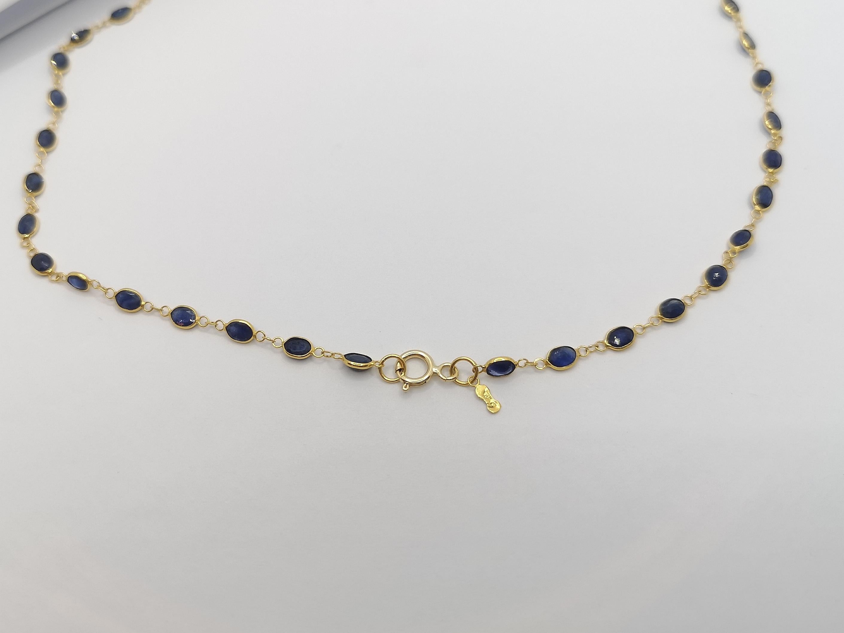 Oval Cut Blue Sapphire Necklace Set in 18 Karat Gold Settings For Sale