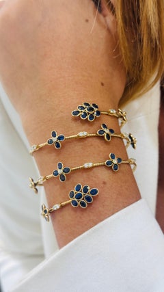 Blue Sapphire Oval And Diamond Bangle In 18K Yellow Gold