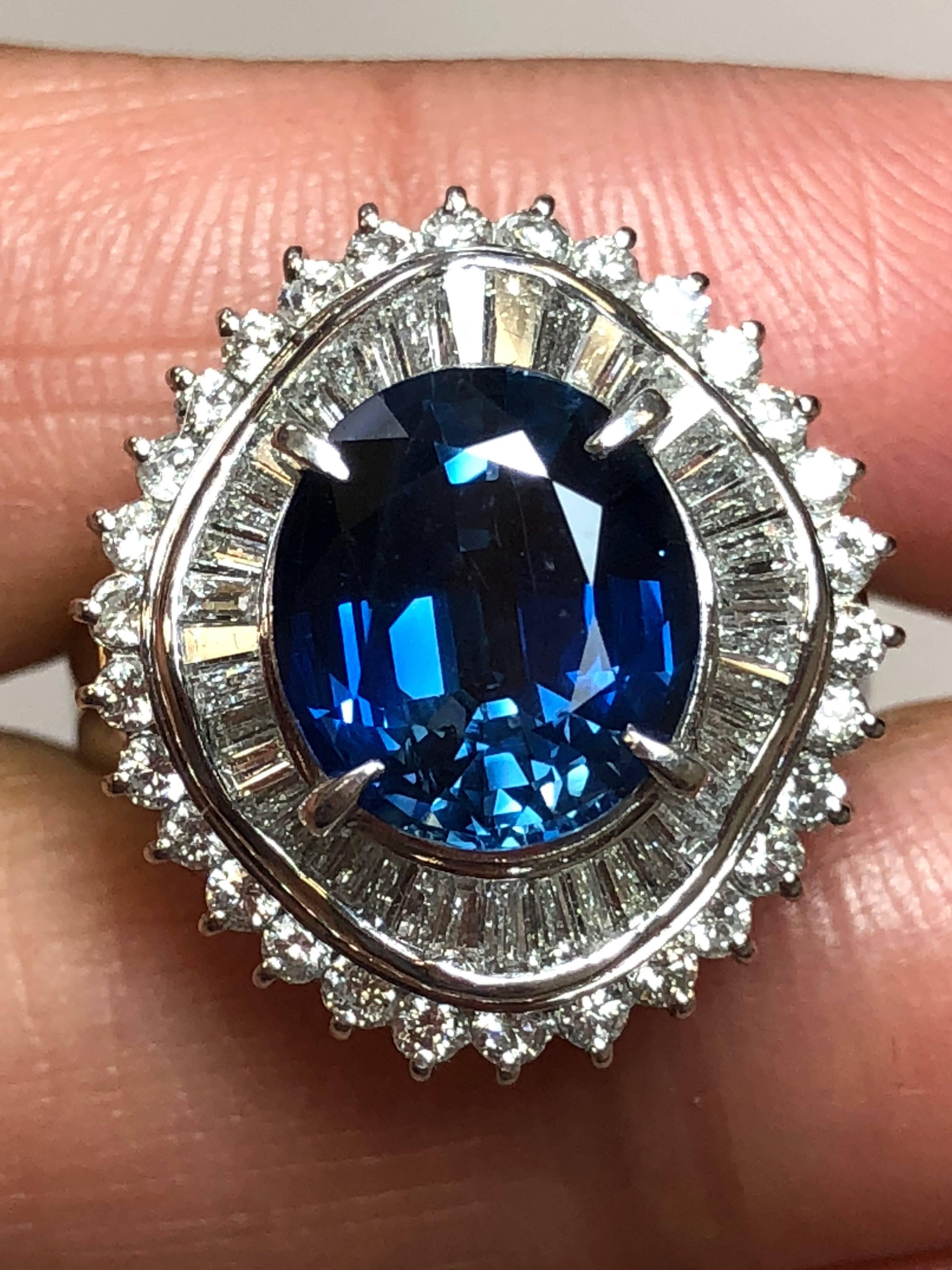 Lovely 4.01 carat blue sapphire oval surrounded by 1.45 carats of brilliant white diamonds in this beautiful platinum mounting. The classic design using baguettes and rounds makes this piece timeless. Size 7.75 and a perfect addition to any