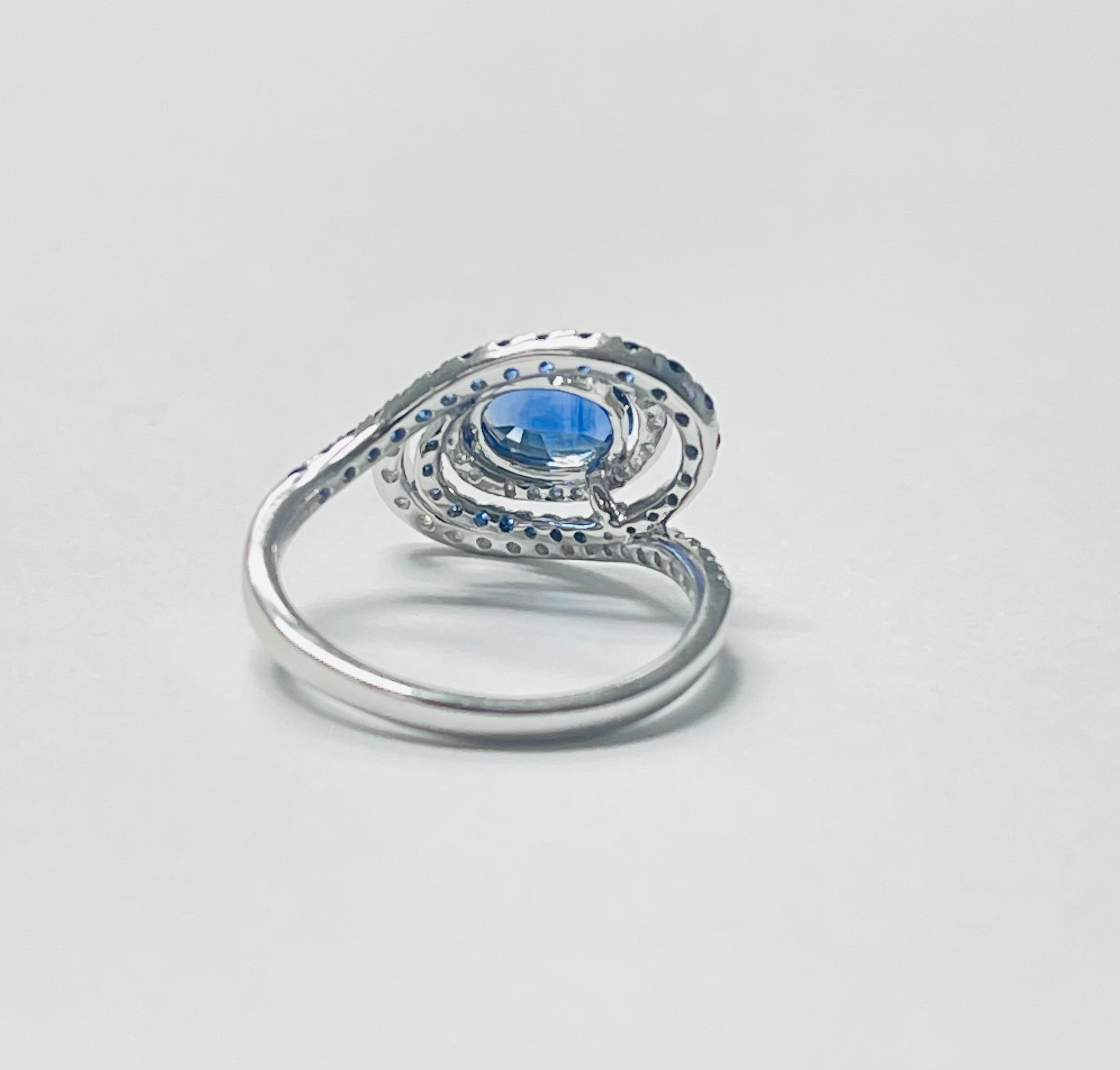 Contemporary Blue Sapphire Oval and Diamond Engagement Ring in 18k White Gold For Sale