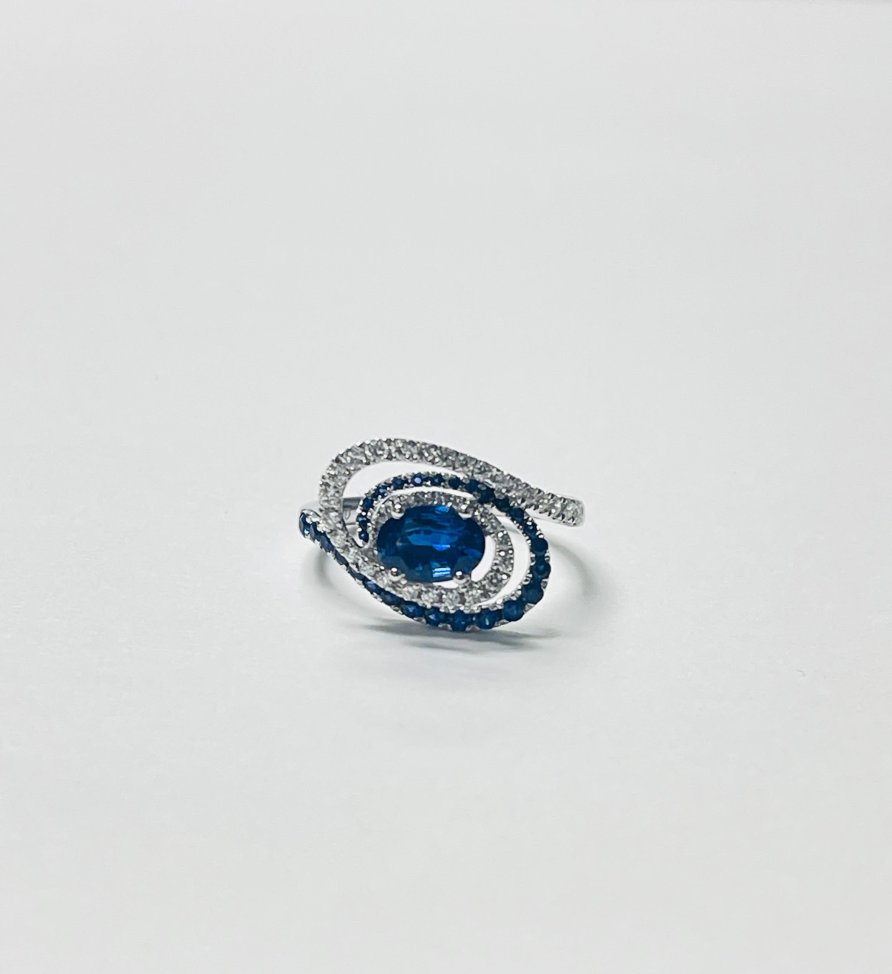 Women's Blue Sapphire Oval and Diamond Engagement Ring in 18k White Gold For Sale