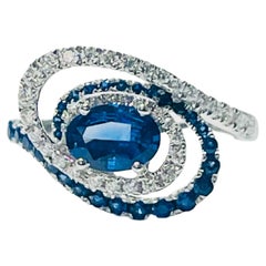 Blue Sapphire Oval and Diamond Engagement Ring in 18k White Gold