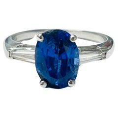 Blue Sapphire Oval and Diamond Engagement Ring in Platinum