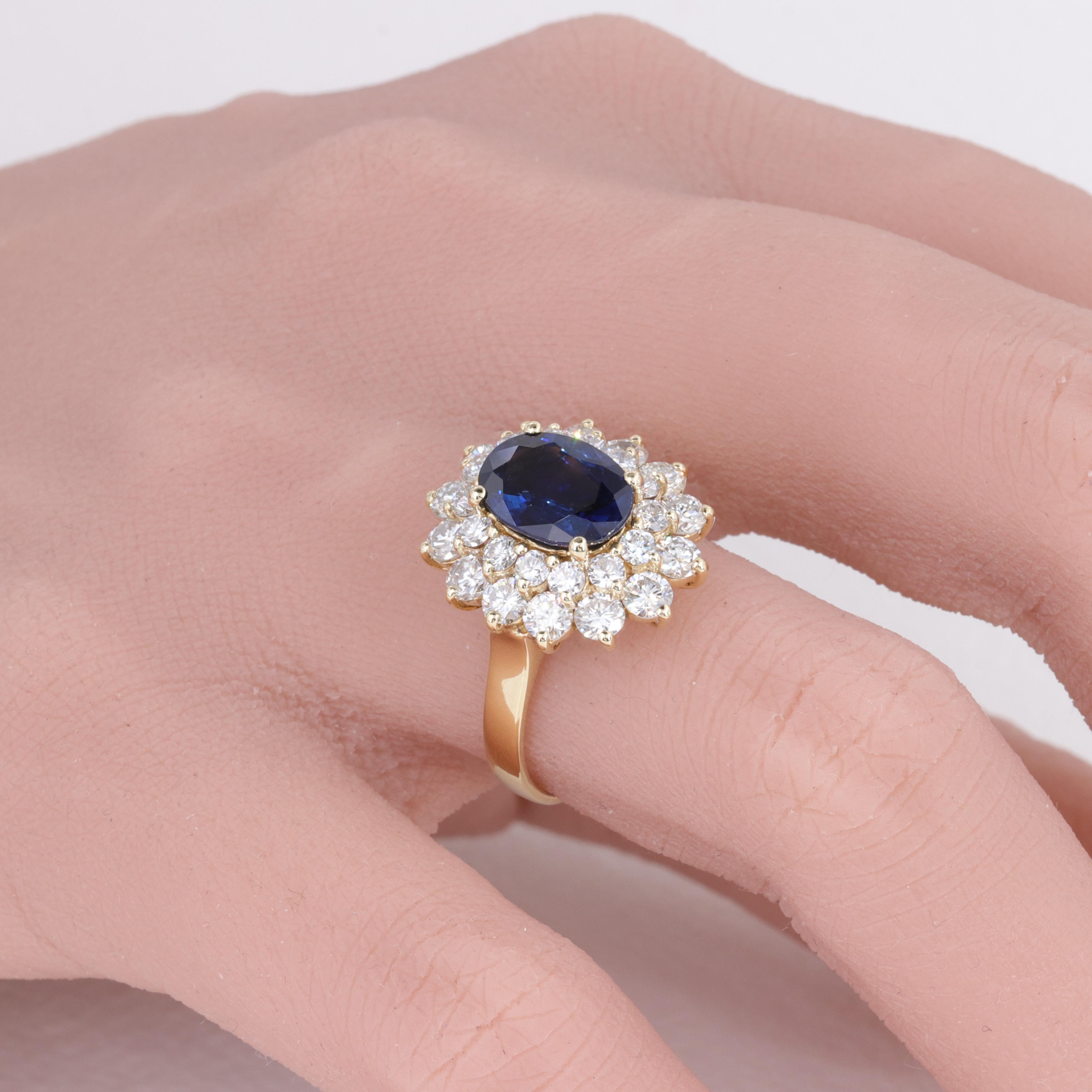 Blue Sapphire Oval and Diamond Halo Ring by Mayors in 18 Karat Yellow Gold

Sapphire:

Carat - Approx 1.80ct
Dimensions - 9.49 x 6.80 x 3.78mm 
Color - Deep Blue
Eye Clean

Diamonds:

Carat - Approx 1.68ct
Color - H/I
Clarity - VS

Ring :

18 Karat